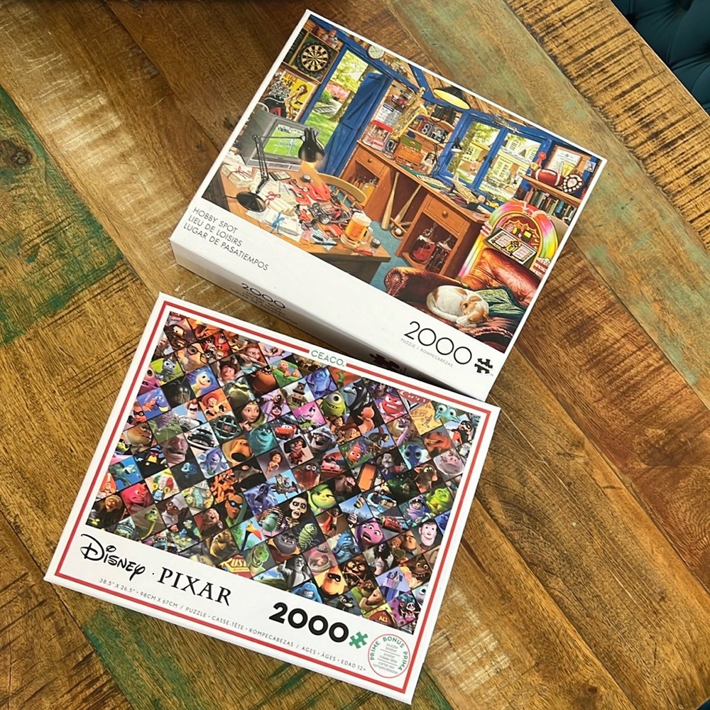 Two 2,000 piece puzzles. Disney Pixar Ceaco. Buffalo Hobby Spot. EUC